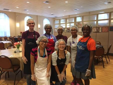 Students wearing hairnets and gloves