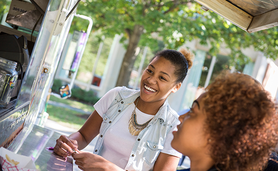 Students getting food at a food truck