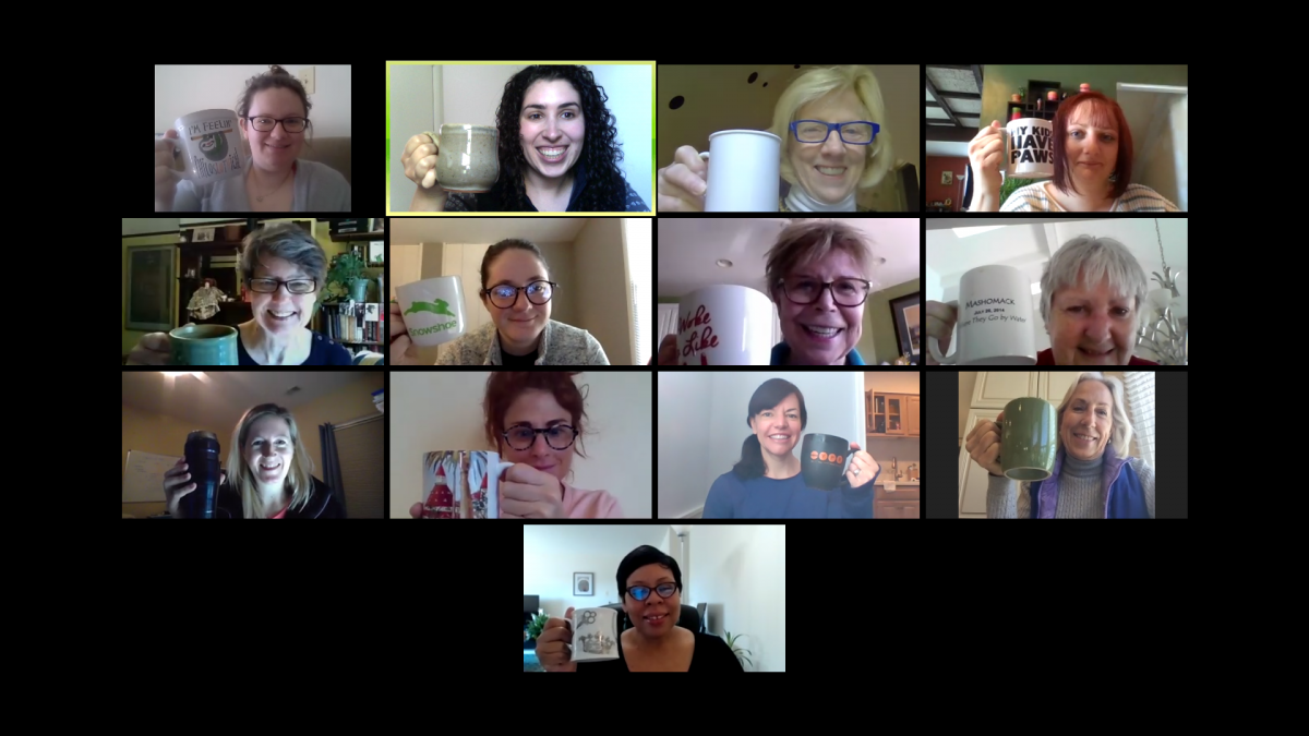 zoom meeting grid of NDMU alum and staff holding up coffee cups