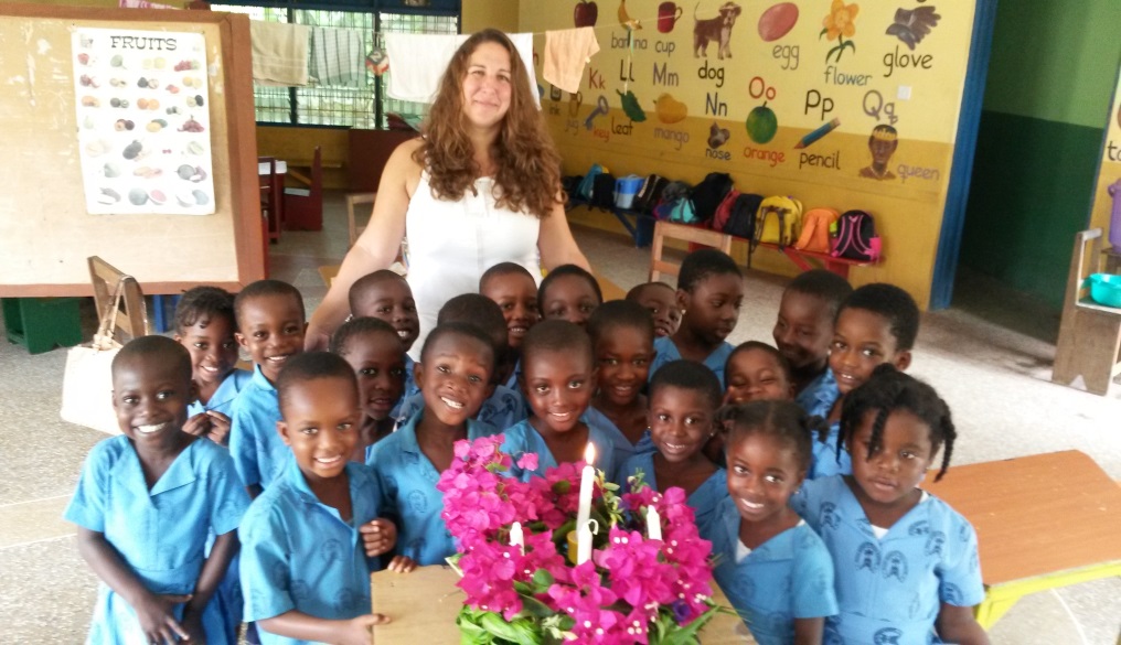 Student teacher in Africa with a class of small children