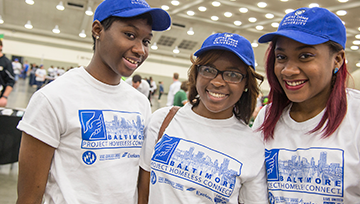 Three student volunteers at a service event