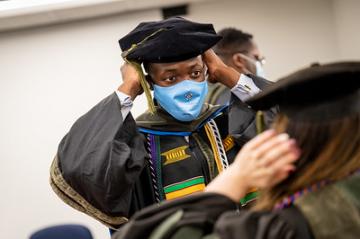 A School of Pharmacy student getting ready for graduation