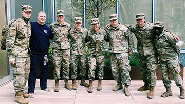 Ricelle Taganas '20, pictured fourth from left with Army Reserves in NYC Ricelle Taganas, NDMU student, poses with her Army Reserves team in fatigues in NYC