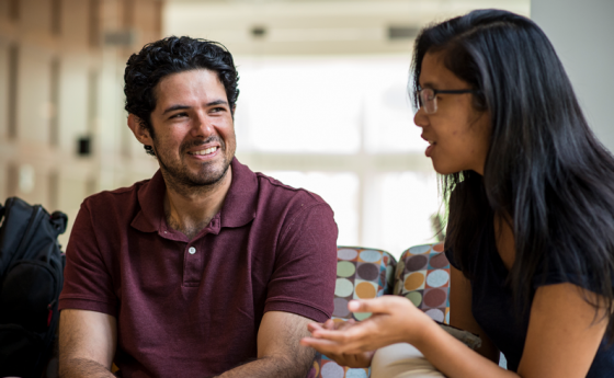 Two students sitting and talking