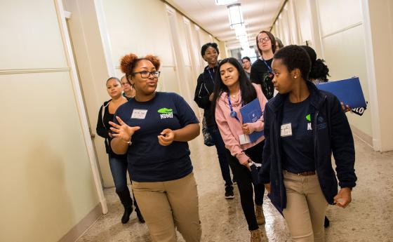 group of students walking down hall