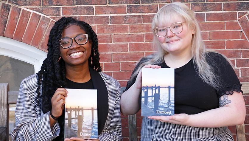 Rochelle Thompson (left) and Lindsey Pytrykow (right) pose with copies of Damozel
