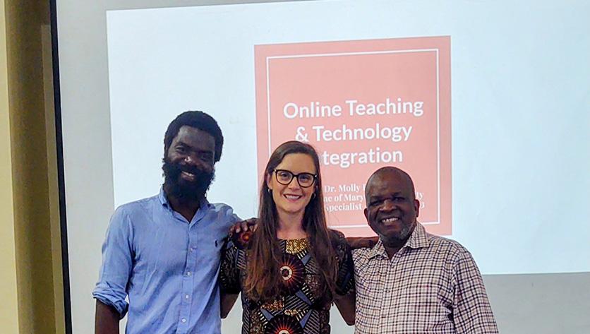 Molly Dunn stands between two professors from Malawi