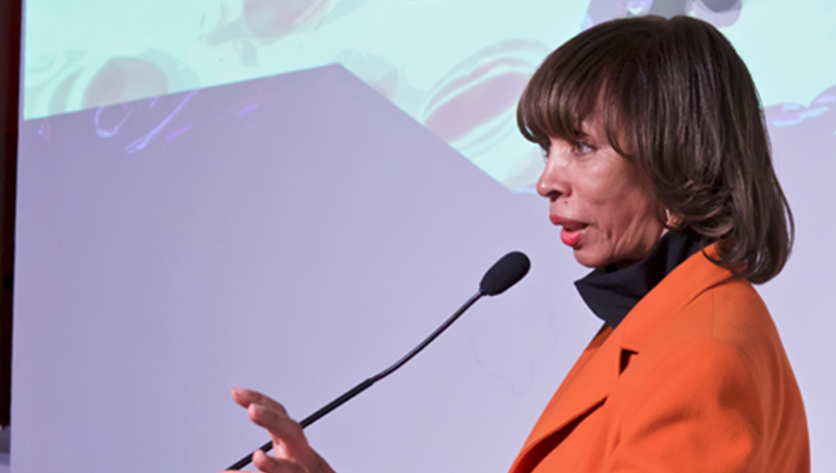 Mayor Catherine E. Pugh speaking into a microphone