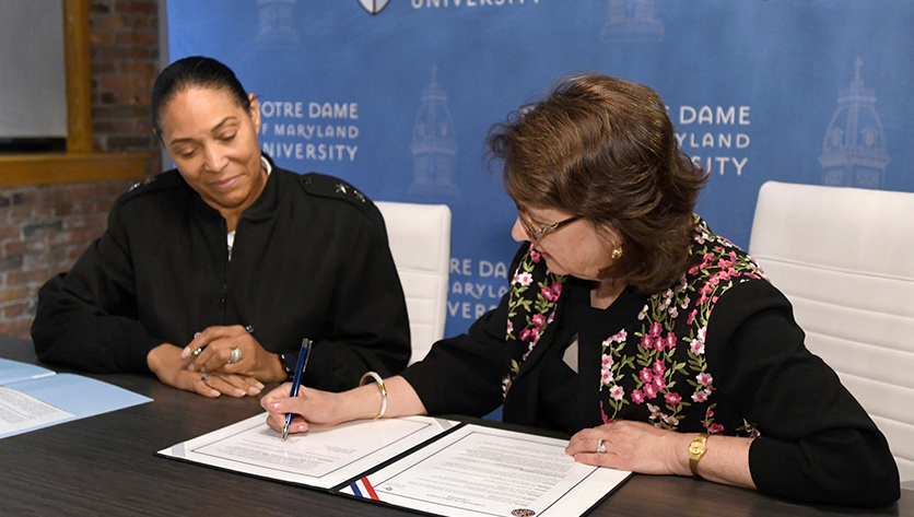 Dr. Yam & Maj. Gen. Linda L. Singh sign partnership Dr. Yam & Maj. Gen. Linda L. Singh sign partnership