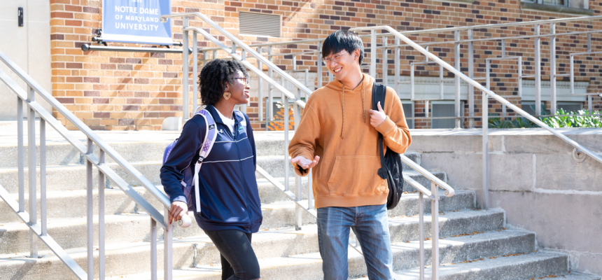 two students talking outside