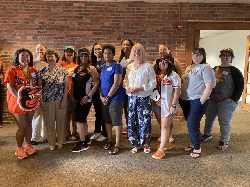 alumni and Dr. Yam at camden yards