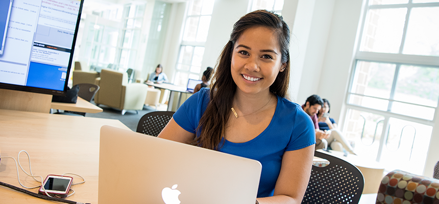 Female student working on a laptop
